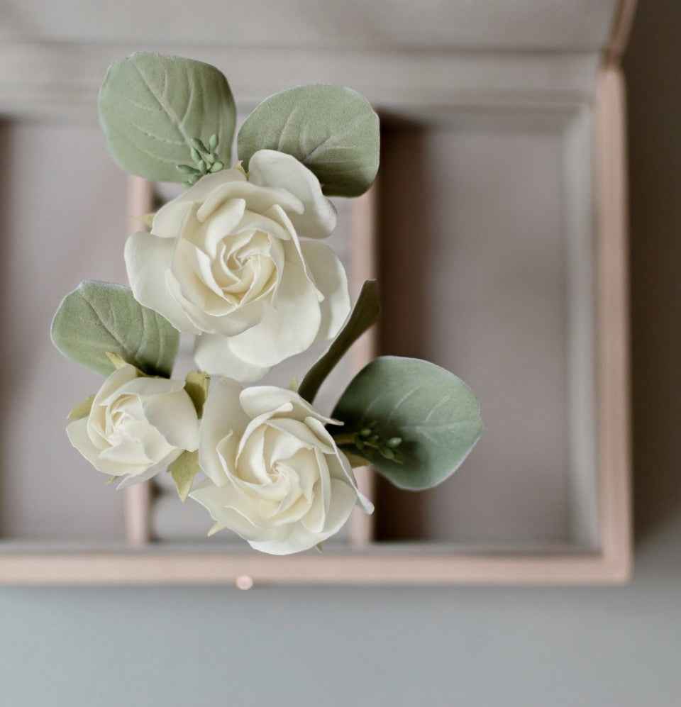 Ivory roses and eucalypt leaves
