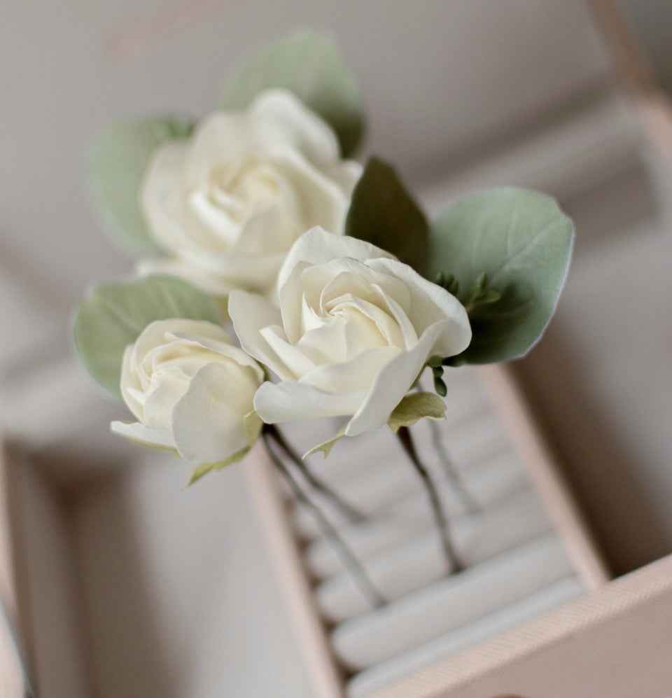 Ivory roses and eucalypt leaves
