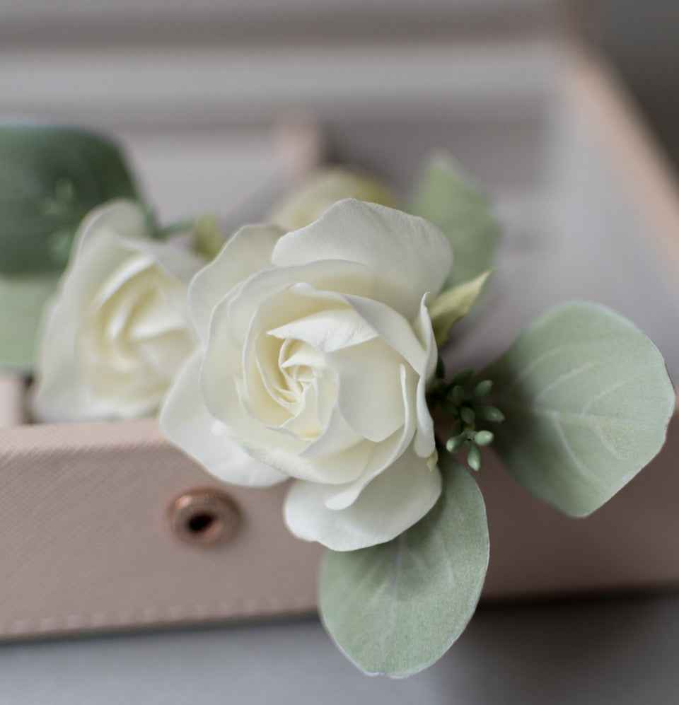Ivory roses and eucalypt leaves