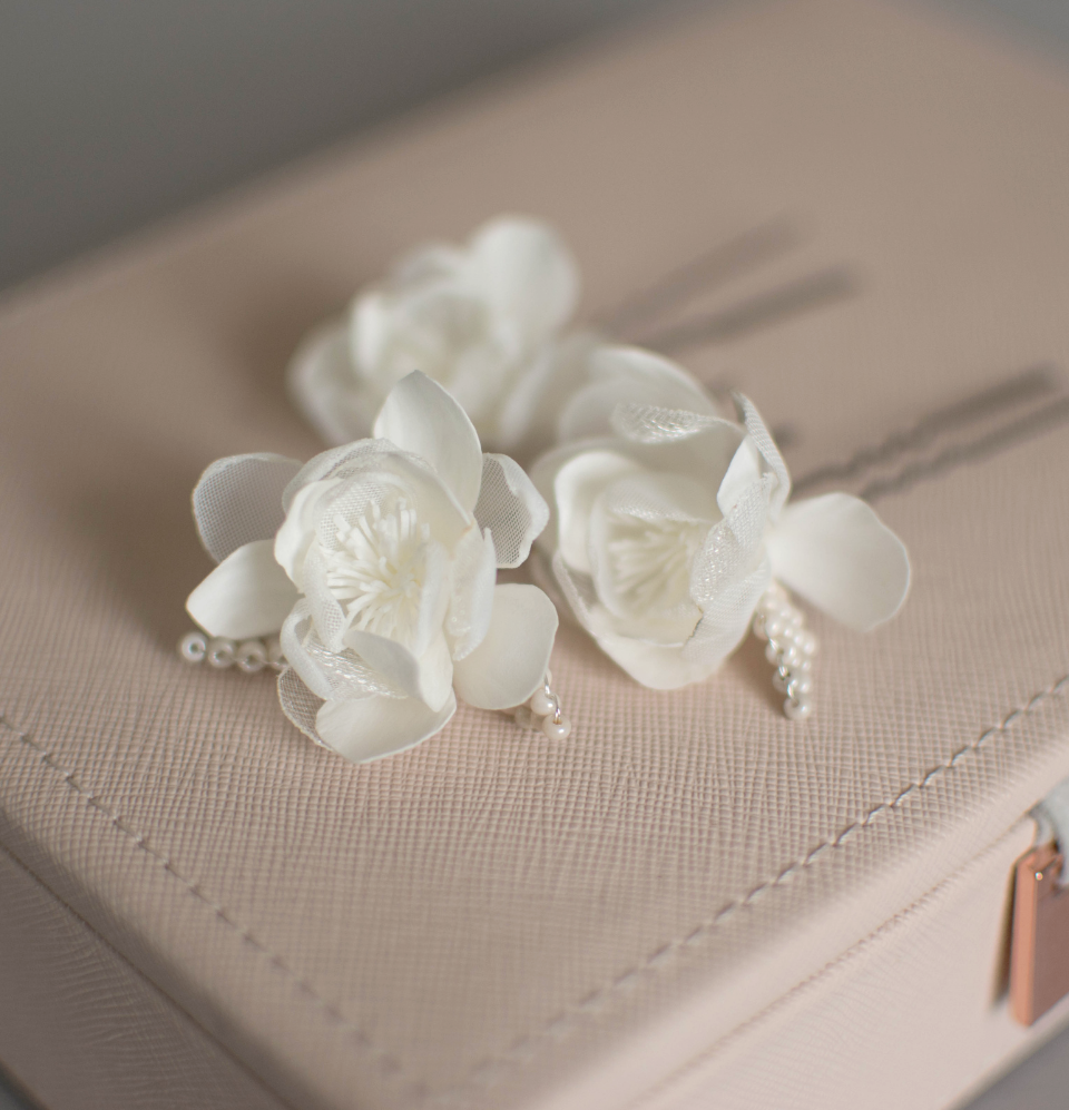 Ivory wedding flowers on hair pins