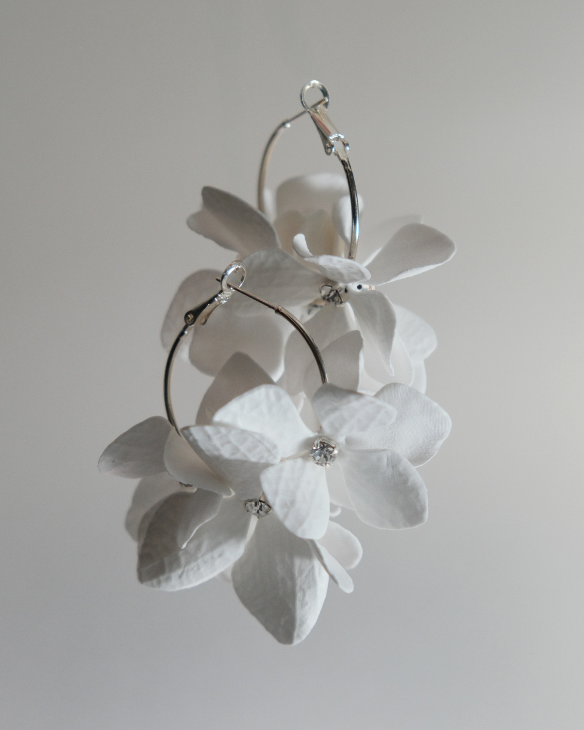 White floral hoop earrings