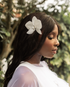 Handmade white orchid bridal hair flower worn as a side accent