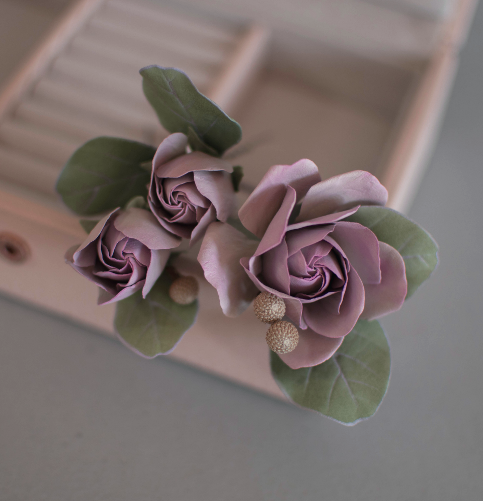 Purple-pink roses with eucalypt leaves and bunias