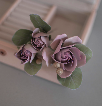 Purple-pink roses with eucalypt leaves and bunias