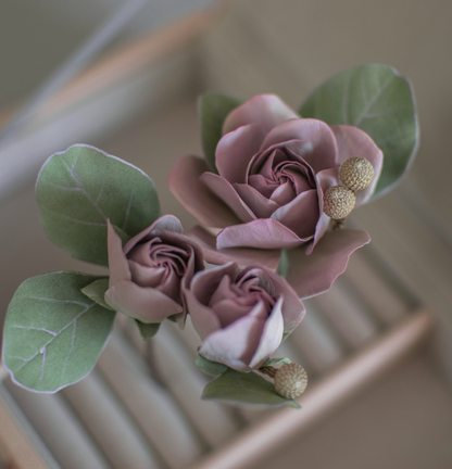 Purple-pink roses with eucalypt leaves and bunias