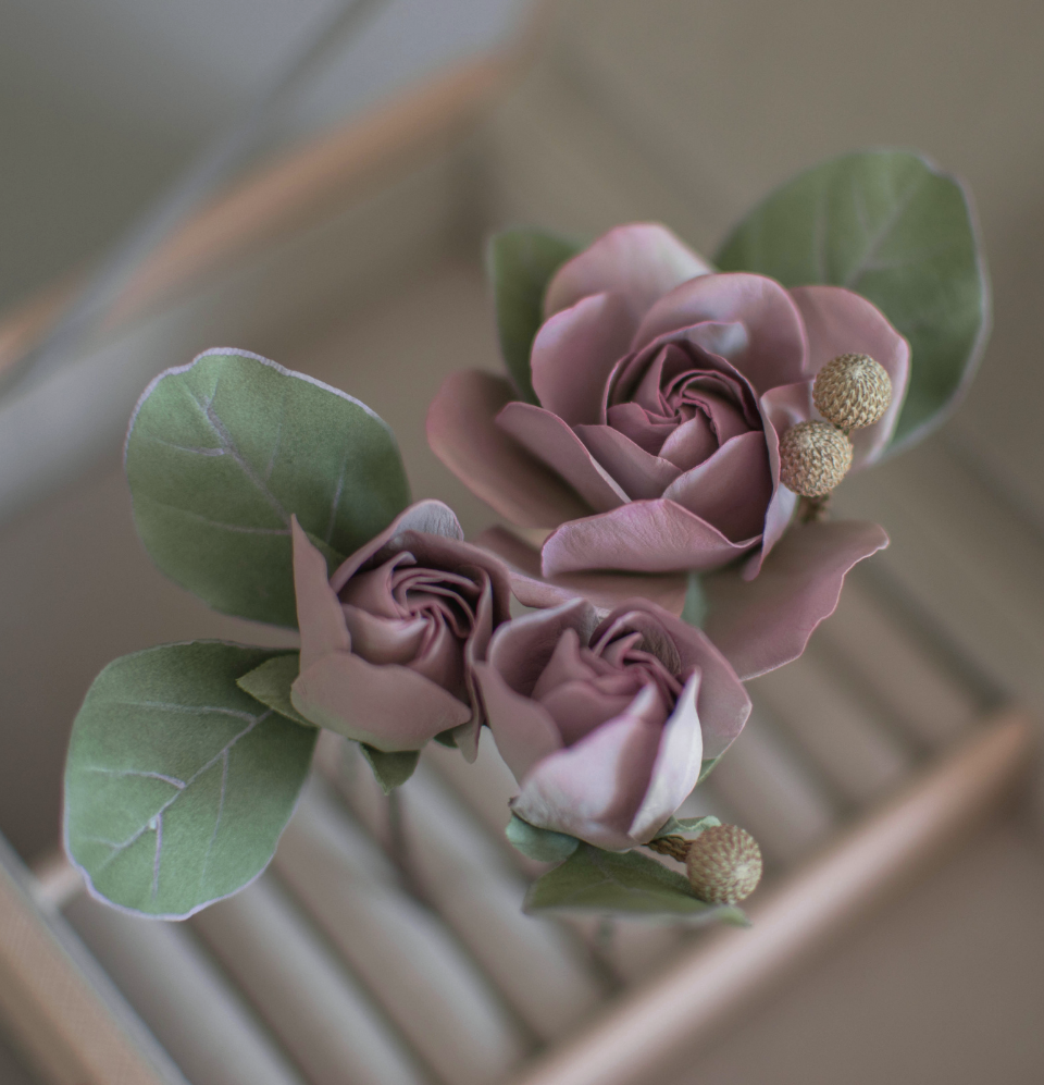 Purple-pink roses with eucalypt leaves and bunias
