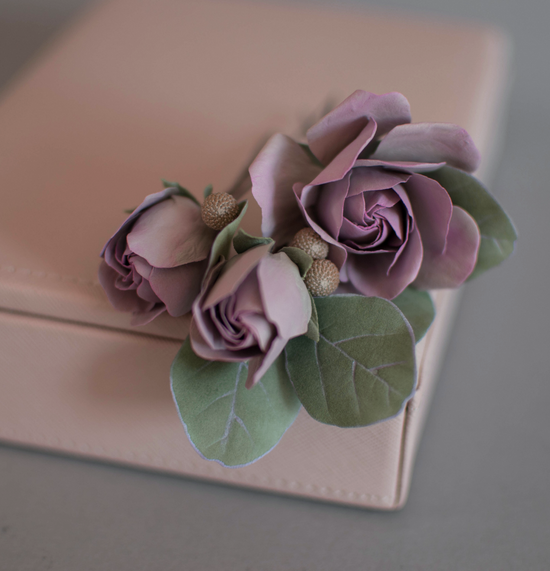 Purple-pink roses with eucalypt leaves and bunias