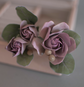 Purple-pink roses with eucalypt leaves and bunias