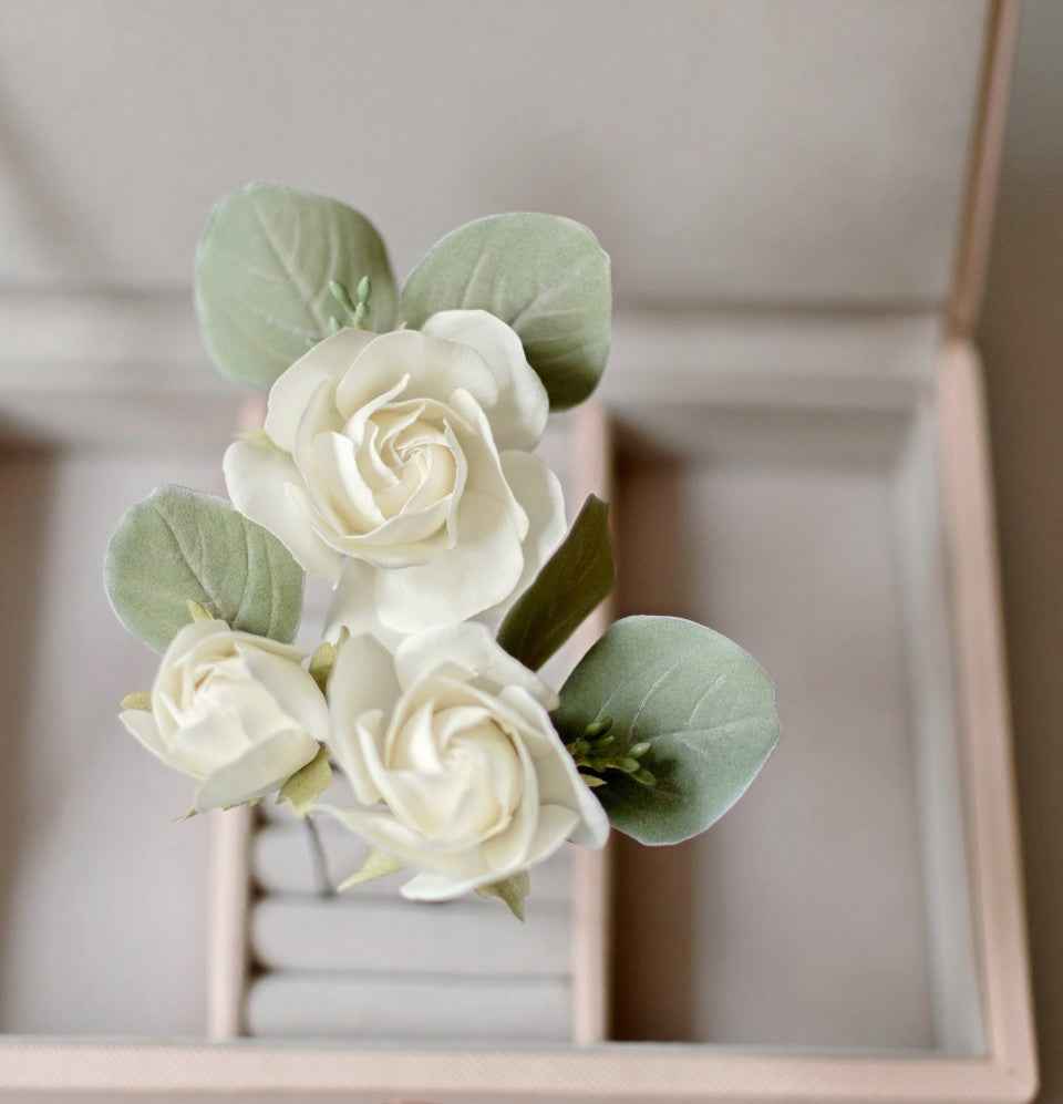 Ivory roses and eucalypt leaves