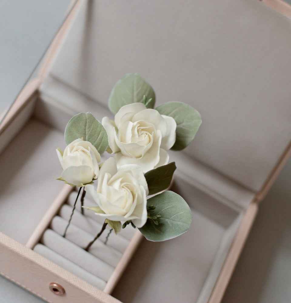 Ivory roses and eucalypt leaves
