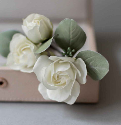 Ivory roses and eucalypt leaves