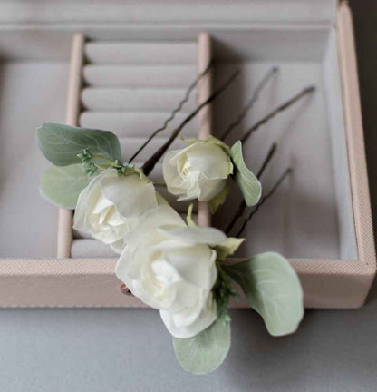 Ivory roses and eucalypt leaves