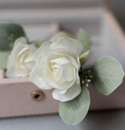 Ivory roses and eucalypt leaves