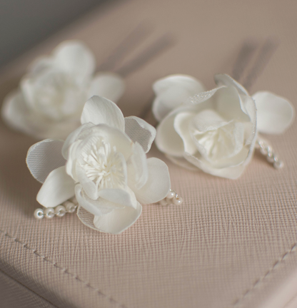 Ivory wedding flowers on hair pins