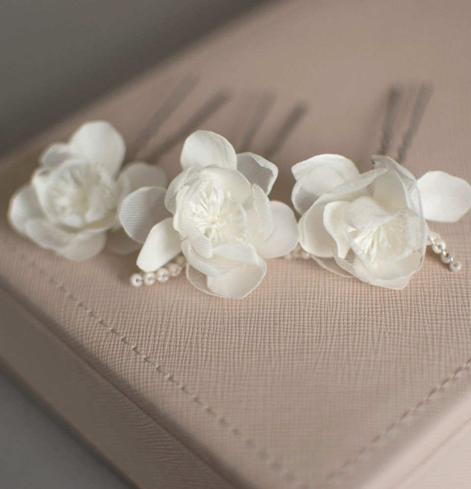 Ivory wedding flowers on hair pins