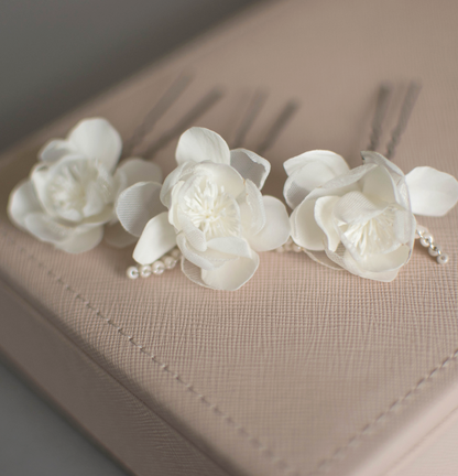 Ivory wedding flowers on hair pins