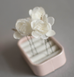 Ivory wedding flowers on hair pins
